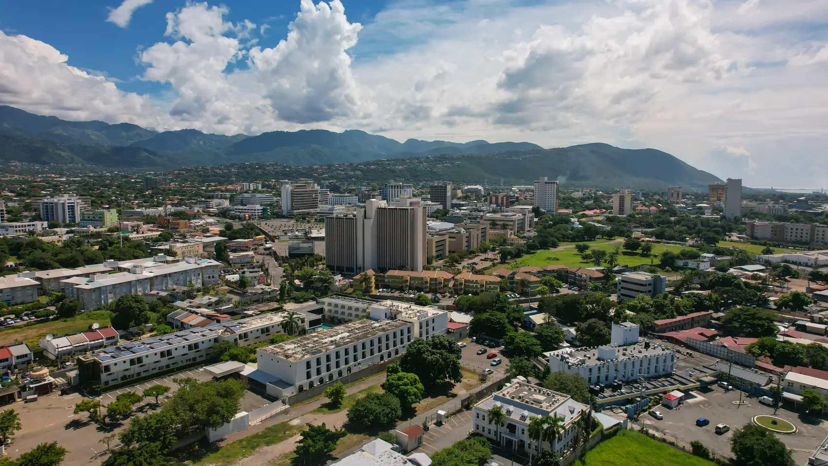 Aerial view of Kingston city, Jamaica. City landscape, roads, buildings, mountains